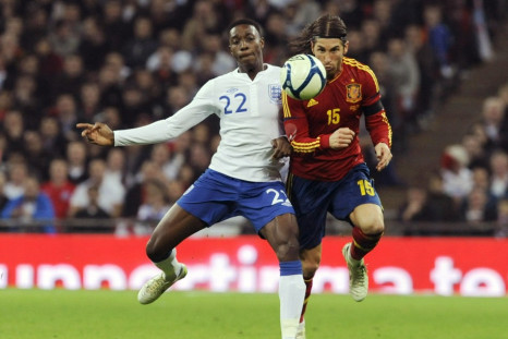 Spain's Ramos and England's Welbeck challenge for the ball during their international friendly soccer match in London