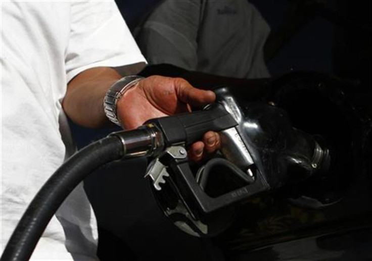 A motorist pumps fuel into his vehicle at JJ&#039;s Express Gas Plus station in Phoenix gas station in Phoenix