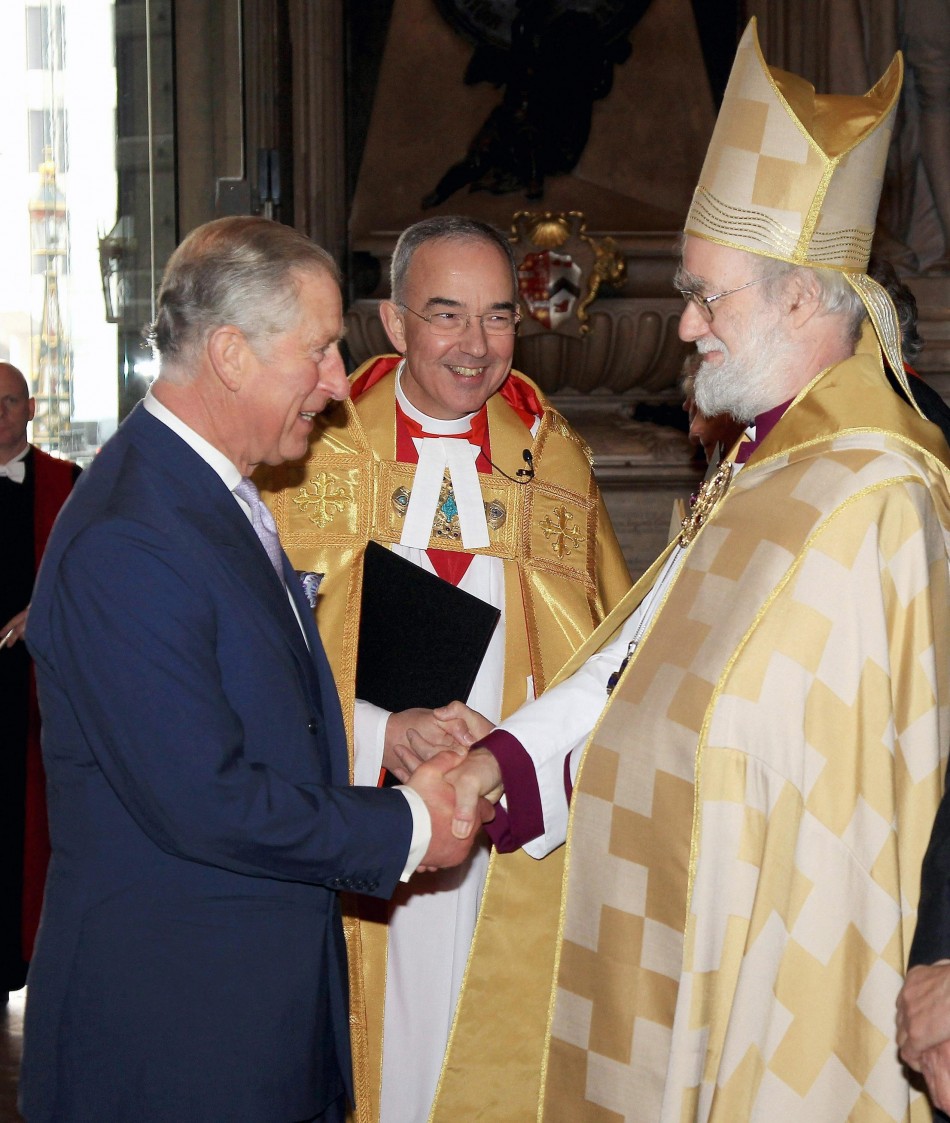 The Prince of Wales greets the Archbishop of Canterbury Dr Rowan Williams as he attends a service of celebration to mark the 400th Anniversary of the King James Bible