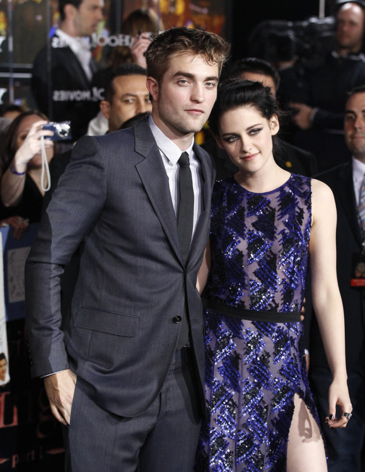 Cast members Robert Pattinson and Kristen Stewart pose at the premiere of &quot;The Twilight Saga: Breaking Dawn - Part 1&quot; at Nokia Theatre in Los Angeles