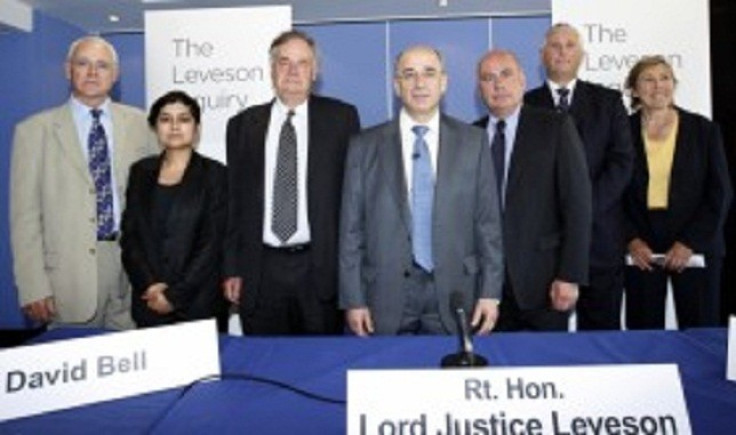 Lord Justice Leveson (centre) and the assessors of his inquiry into culture practices and ethics of the press (from left to right) George Jones, Shami Chakrabarti, David Bell, David Currie, Paul Scott-Lee and Elinor Goodman.