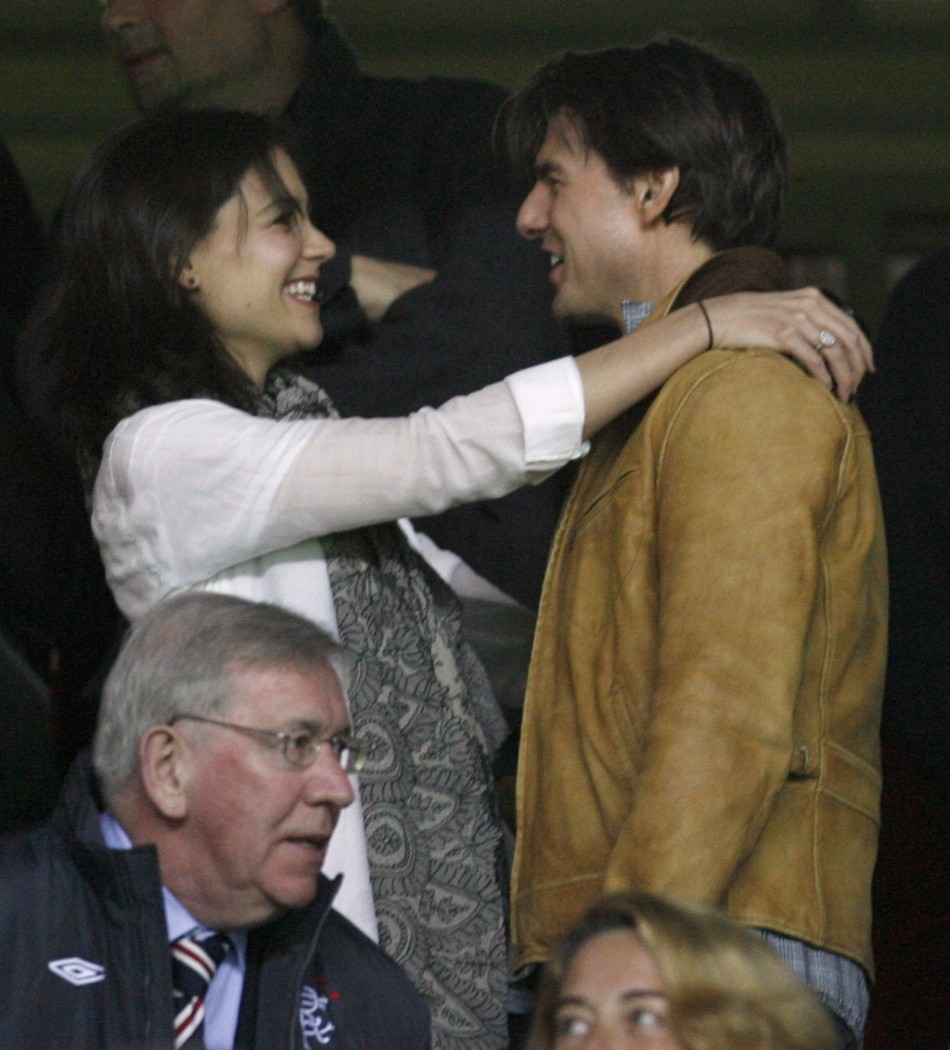 Tom Cruise is hugged by wife Katie Holmes before Champions League soccer match between Sevilla and Rangers in Seville