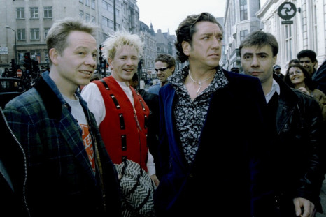 The four original members of the Sex pistols (L-R) Paul Cook, Johnny Rotten, Steve Jones, and Glen Matlock arrive at a press conference at the 100 Club in central London, March 18