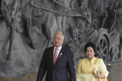 Malaysia's PM Razak and wife Rosmah Mansor arrive at the Bali Nusa Dua Convention Center before the opening ceremony of the ASEAN Summit in Nusa Dua, Bali