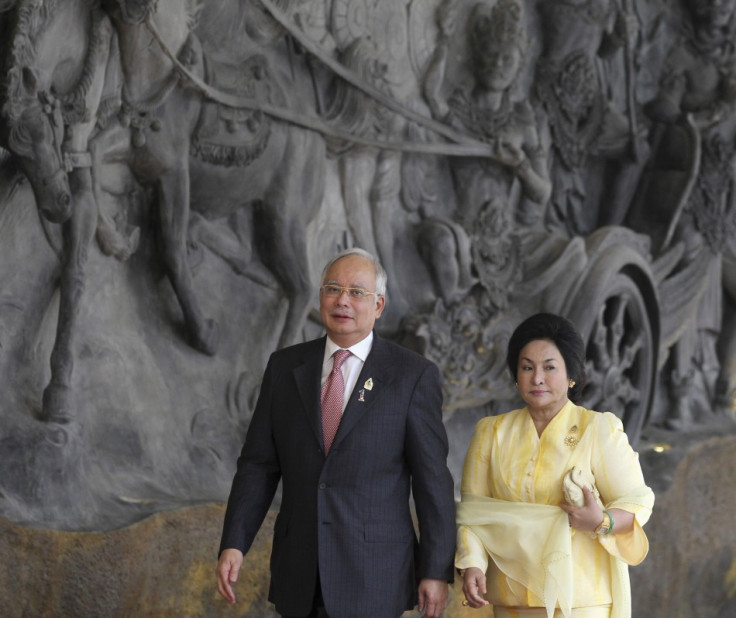 Malaysia's PM Razak and wife Rosmah Mansor arrive at the Bali Nusa Dua Convention Center before the opening ceremony of the ASEAN Summit in Nusa Dua, Bali