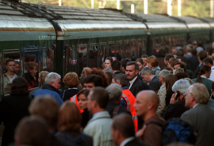 People waiting to board a train