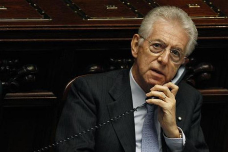 Italy's Prime Minister Mario Monti talks on the phone during a vote of confidence at the Lower House of Parliament in Rome