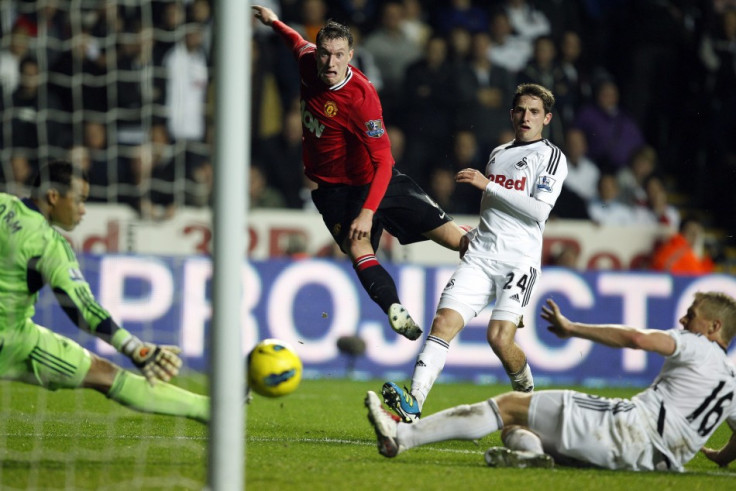 Manchester United&#039;s Jones shoots at goal during their English Premier League soccer match against Swansea City at the Liberty Stadium in Swansea