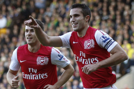 Arsenal&#039;s Van Persie celebrates his first goal against Norwich City during their English Premier League soccer match in Norwich