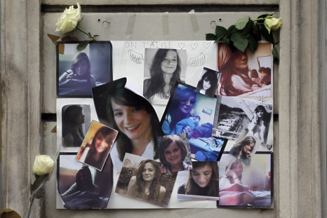 Photographs of Agnes, the 13-year-old murdered French teenager, are displayed outside the building where her parents reside in Paris