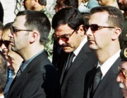 Syrian President Bashar al-Assad , his brother Maher and brother-in-law Asef Shawkat stand during funeral of late President Hafez al-Assad in Damascus