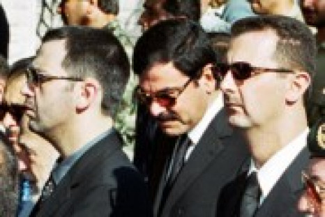 Syrian President Bashar al-Assad , his brother Maher and brother-in-law Asef Shawkat stand during funeral of late President Hafez al-Assad in Damascus