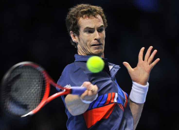 Murray of Britain returns the ball during his singles tennis match against Ferrer of Spain at the ATP World Tour Finals in London
