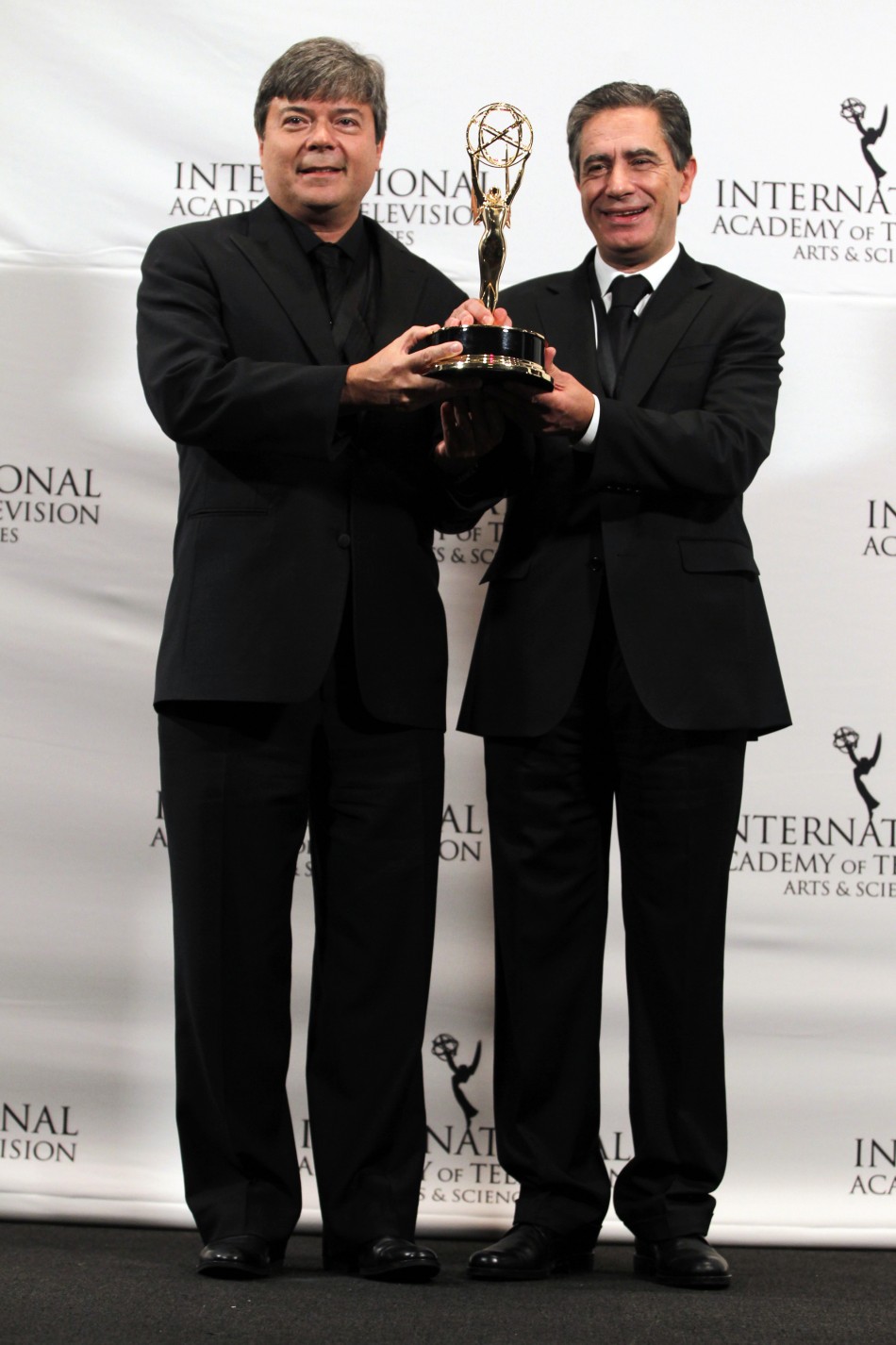 Telenovela award winners Bokel and Marques pose for photographers at the International Emmy Awards