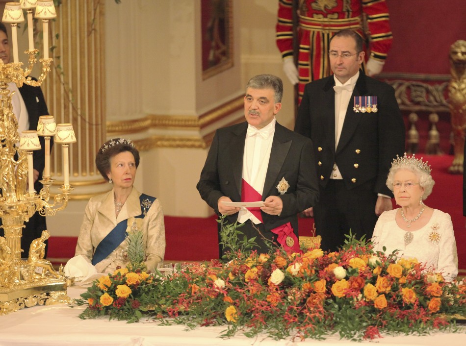 Queen Elizabeth R, and Princess Anne L listen to a speech by the President of Turkey, Abdullah Gul, at a state banquet in Buckingham Palace, in central London November 22, 2011.