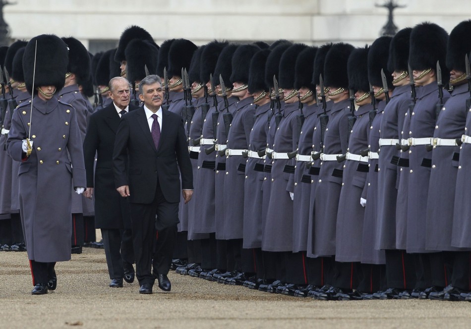 The President of Turkey Abdullah Gul FRONT R, accompanied by Britains Prince Philip FRONT C reviews a Guard of Honour on Horse Guards Parade, in central London November 22, 2011.