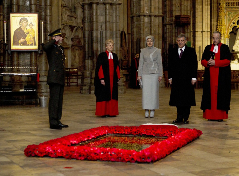 The President of Turkey Abdullah Gul 2nd R, accompanied by his wife Hayrunnnisa 3rd L, stands at the tomb of the unknown soldier in Westminster Abbey in central London November 22, 2011