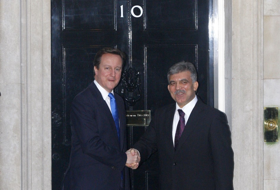 The President of Turkey Abdullah Gul L speaks to Britains Prime Minister David Cameron in 10 Downing Street.