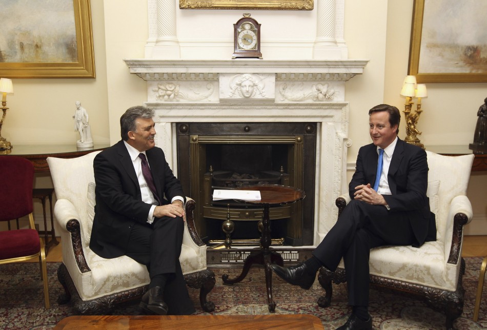 The President of Turkey Abdullah Gul L speaks to Britains Prime Minister David Cameron in 10 Downing Street.