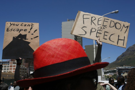 Demonstrators protest against the passing of the Protection of Information Bill outside Parliament in Cape Town