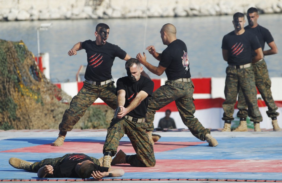 Commandos stage a combat drill during a military parade to celebrate the 68th anniversary of Lebanons independence day in Beirut