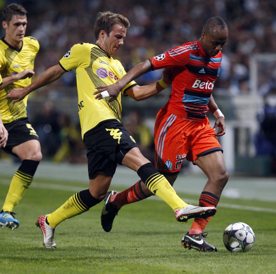 Olympique Marseilles Ayew challenges Borussia Dortmunds Gotze during their UEFA Champions League soccer match at the Velodrome stadium in Marseille