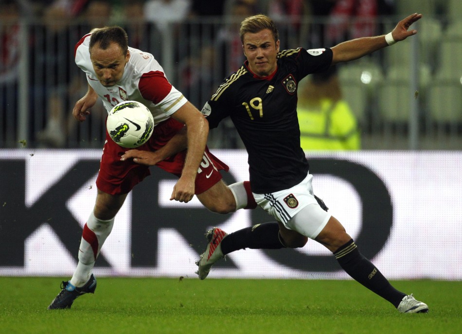 Germanys Gotze fights for the ball with Polands Glowacki during their international friendly soccer match in Gdansk
