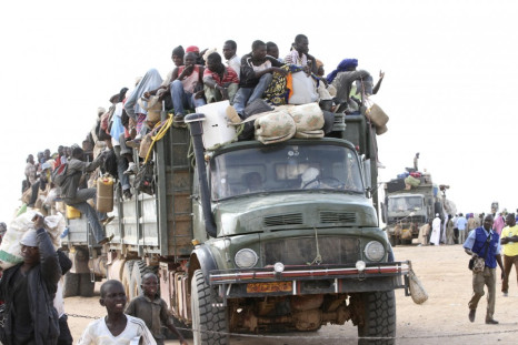 A truck transporting immigrants, who are fleeing the unrest in Libya, and their belongings, arrives in Agadez, northern Niger September 15, 2011.