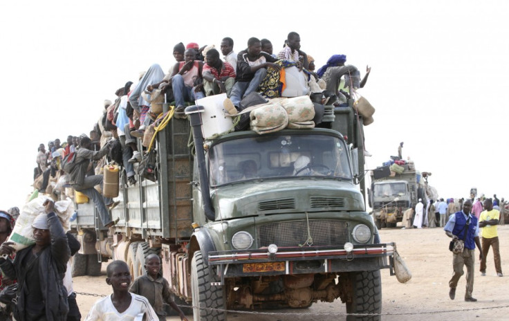A truck transporting immigrants, who are fleeing the unrest in Libya, and their belongings, arrives in Agadez, northern Niger September 15, 2011.