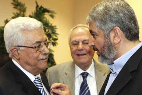 Hamas leader Meshaal talks with President Abbas during their meeting in Cairo