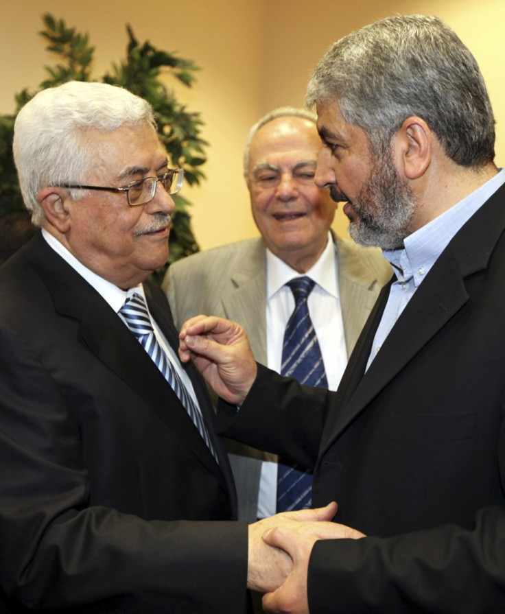 Hamas leader Meshaal talks with President Abbas during their meeting in Cairo