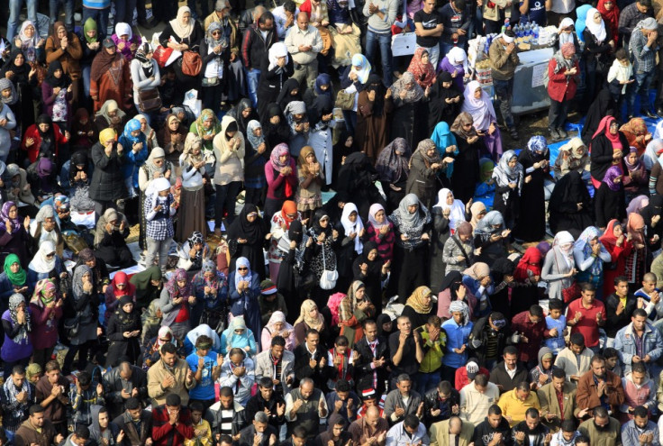 Egyptian protesters pray during a march in Tahrir Square in Cairo