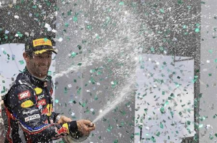 Red Bull Formula One driver Mark Webber of Australia celebrates after winning the Brazilian F1 Grand Prix at the Interlagos circuit in Sao Paulo