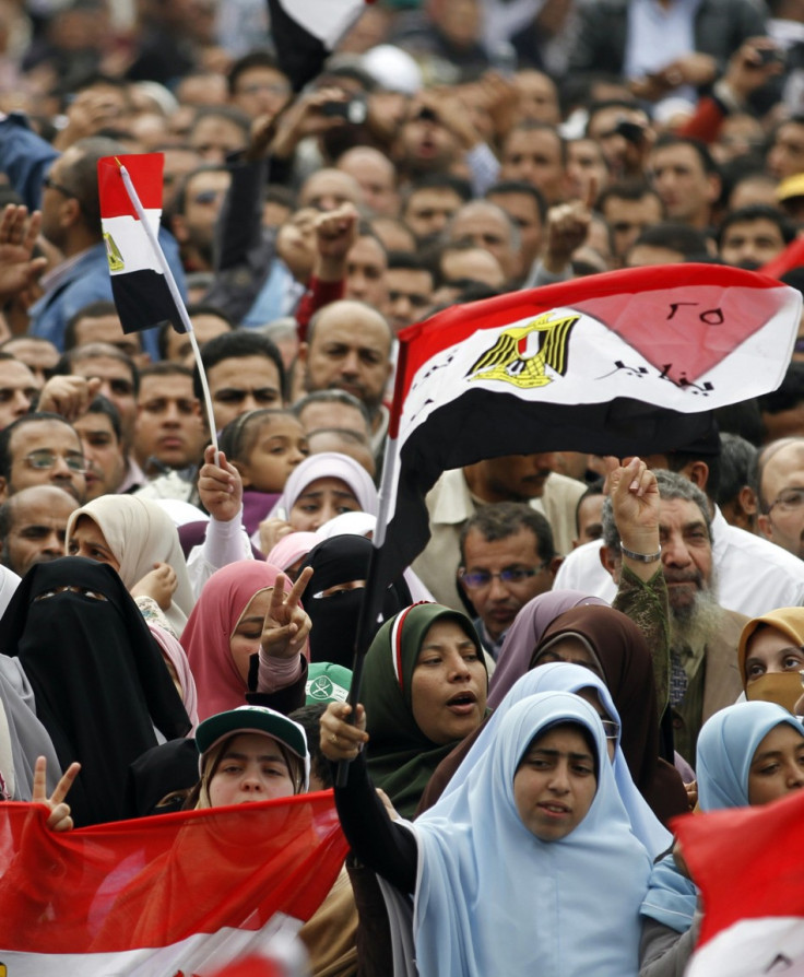 Women gather with other protesters during a demonstration at Tahrir Square in Cairo