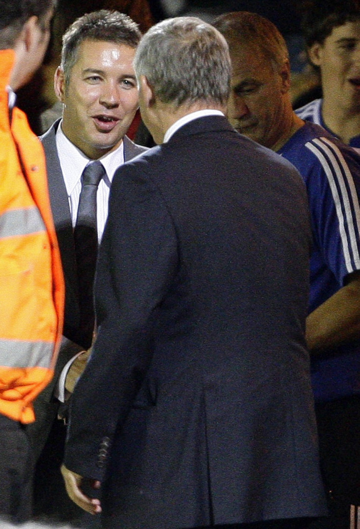 Manchester United&#039;s manager Ferguson shakes hand of his son and Peterborough United manager Darren after their pre-season friendly soccer match in Peterborough