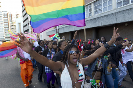 A woman holds her hands up during the Durban Pride parade where several hundred people marched through the Durban city centre in support of gay rights