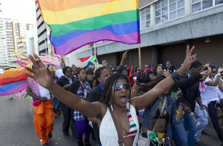 A woman holds her hands up during the Durban Pride parade where several hundred people marched through the Durban city centre in support of gay rights