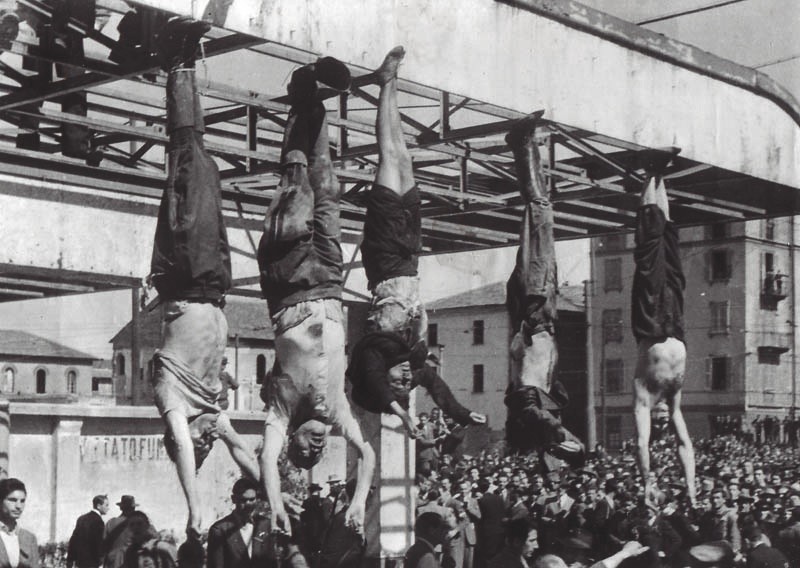 Mussolini hanging from a lamppost along with Claretta Petacci and other fascists