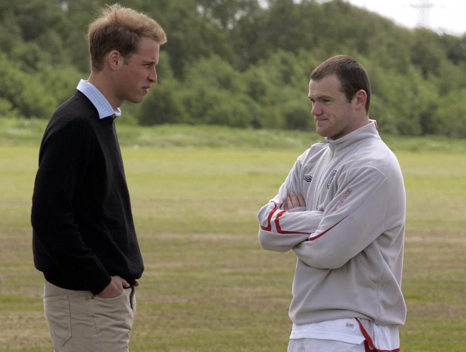 England player Wayne Rooney chats with Prince William during a training session at Manchester Uniteds Carrington complex in Manchester, northern England, June 1, 2006.