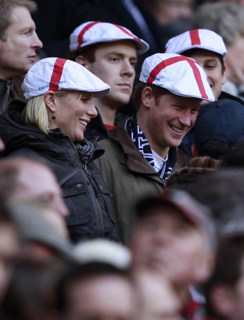 Britains Zara Phillips L talks to Prince Harry before the Six Nations rugby union match between England and France at Twickenham Stadium in London February 26, 2011