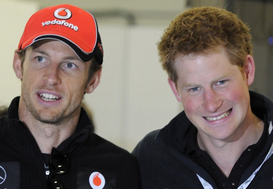 McLaren Formula One driver Jenson Button of Britain speaks with Prince Harry before the British F1 Grand Prix at Silverstone