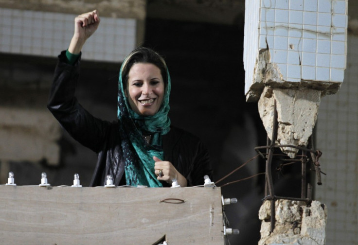 Aisha Gaddafi, daughter of Libya&#039;s leader Muammar Gaddafi,greets her father&#039;s supporters