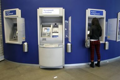 A woman using a ATM machine