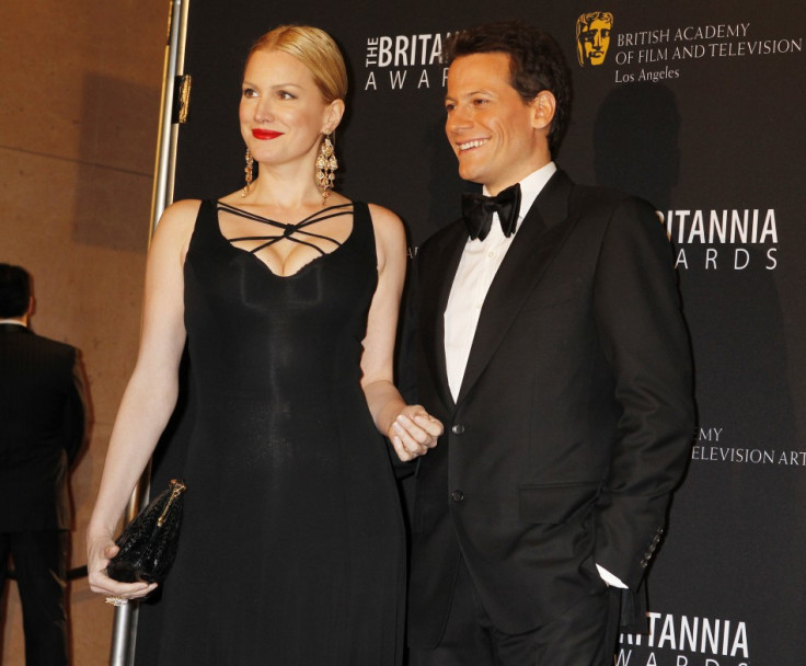Actors Ioan Gruffudd and Alice Evans (L) pose as they arrive at the British Academy of Film and Televison Arts Los Angeles Britannia Awards in Beverly Hills, California