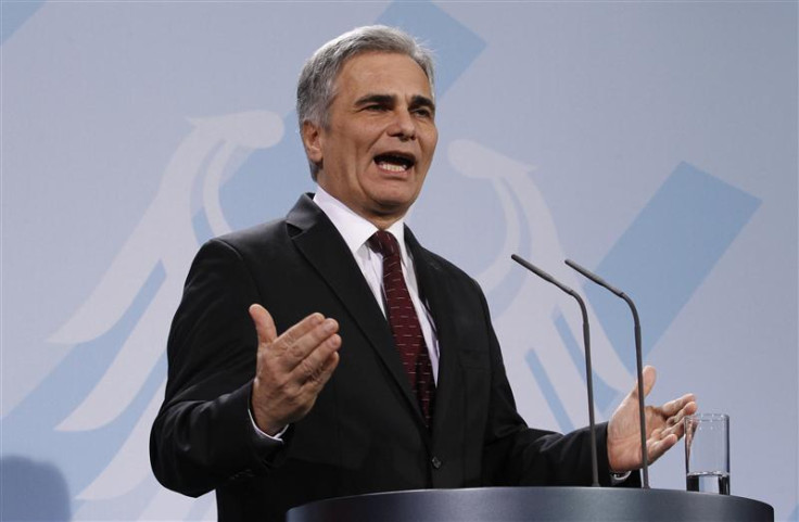 Austrian Chancellor Faymann addresses media in Berlin December 2, 2011.