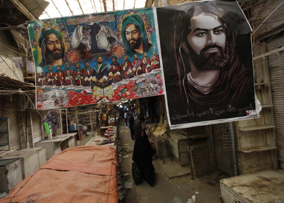Posters of Imam Hussein are sold during ceremony of Ashura at Shurja wholesale market in central Baghdad