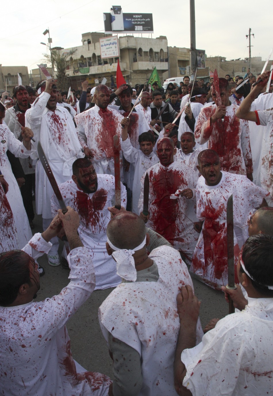 Shiite Iraqi men covered in blood take part in the Ashura procession in Baghdads Sadr City