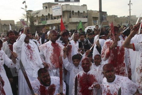 Shi'ite Iraqi men covered in blood take part in the Ashura procession in Baghdad's Sadr City