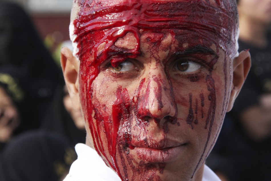 A Shiite man covered in blood takes part in the Ashura procession in Baghdads Sadr City