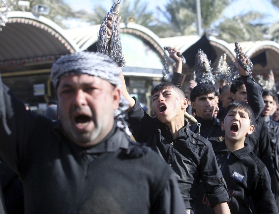 Shiite pilgrims shout during the Ashura ceremony in Kerbala